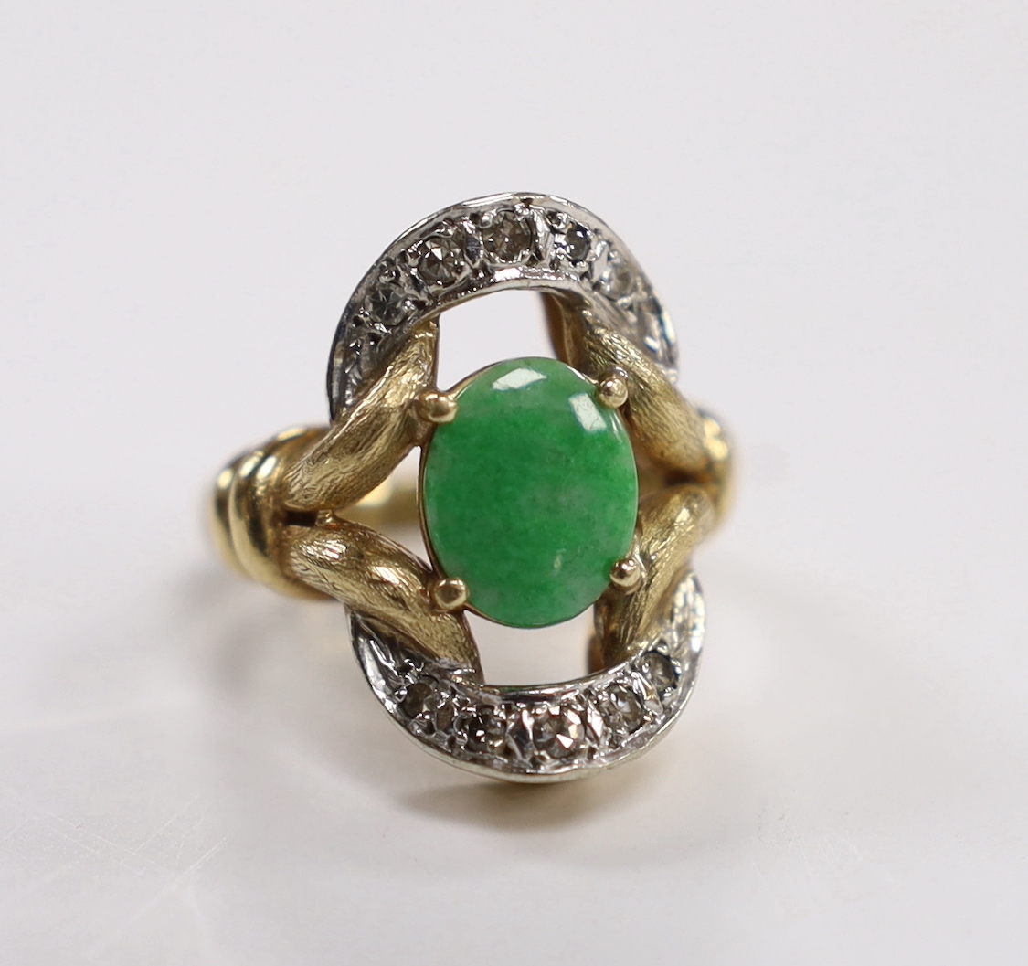 A 14k, oval cabochon jade and diamond cluster set dress ring, size J, gross weight 11.4 grams.